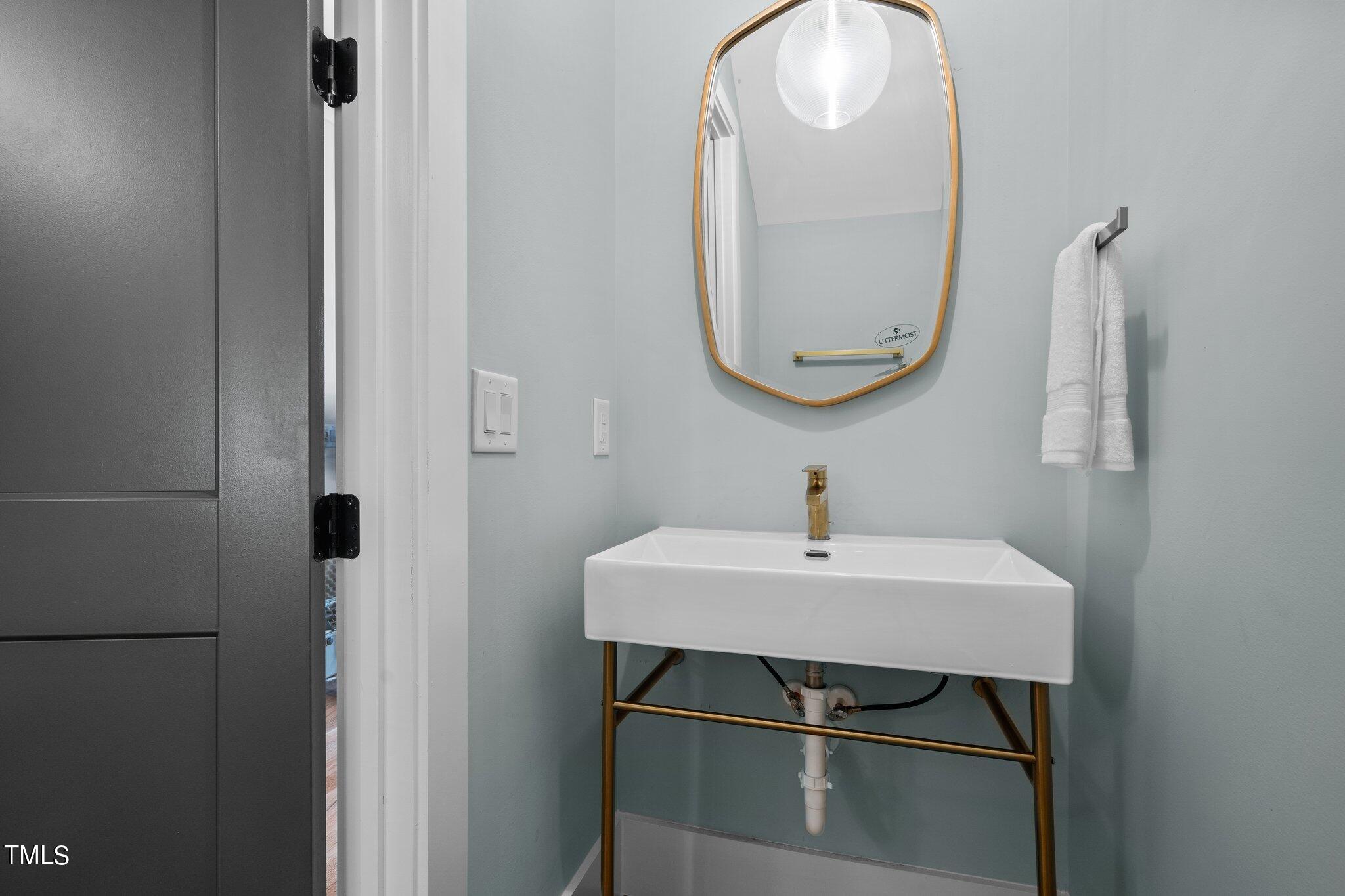 421 Harding Street Raleigh, NC 27604 - Photo 26 of 50 a bathroom with a sink and a mirror