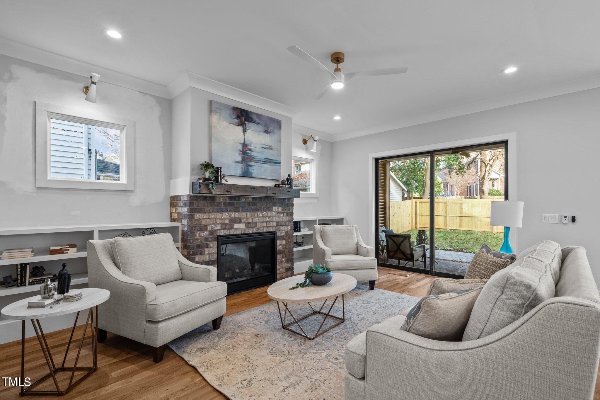 421 Harding Street Raleigh, NC 27604 - Photo 28 of 50 a living room with furniture and a fireplace