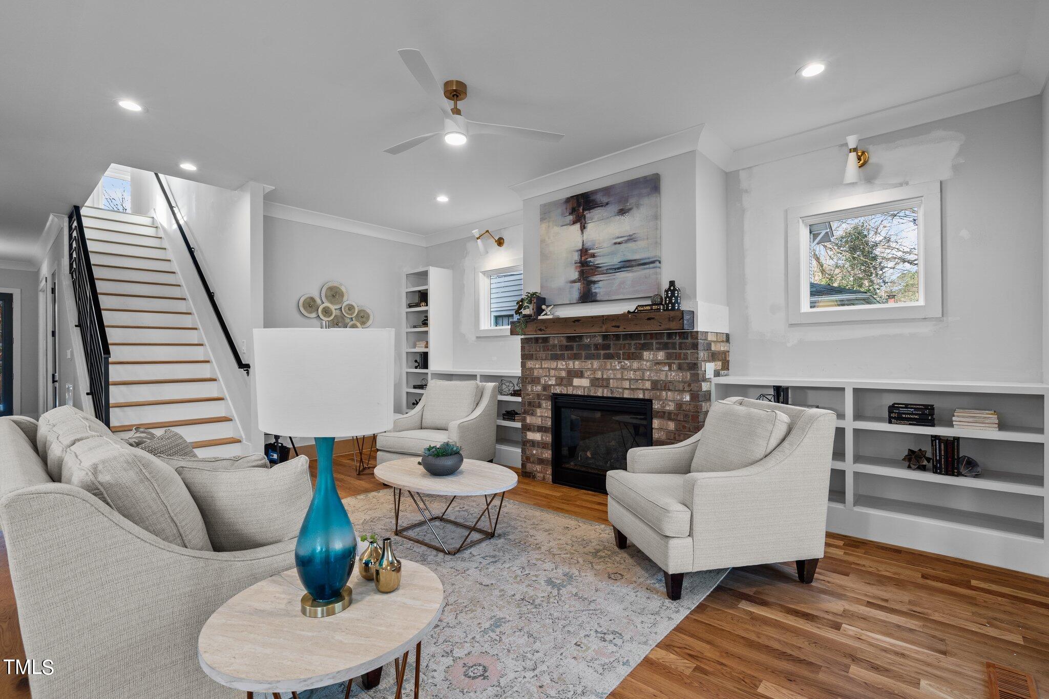 421 Harding Street Raleigh, NC 27604 - Photo 29 of 50 a living room with furniture and a fireplace