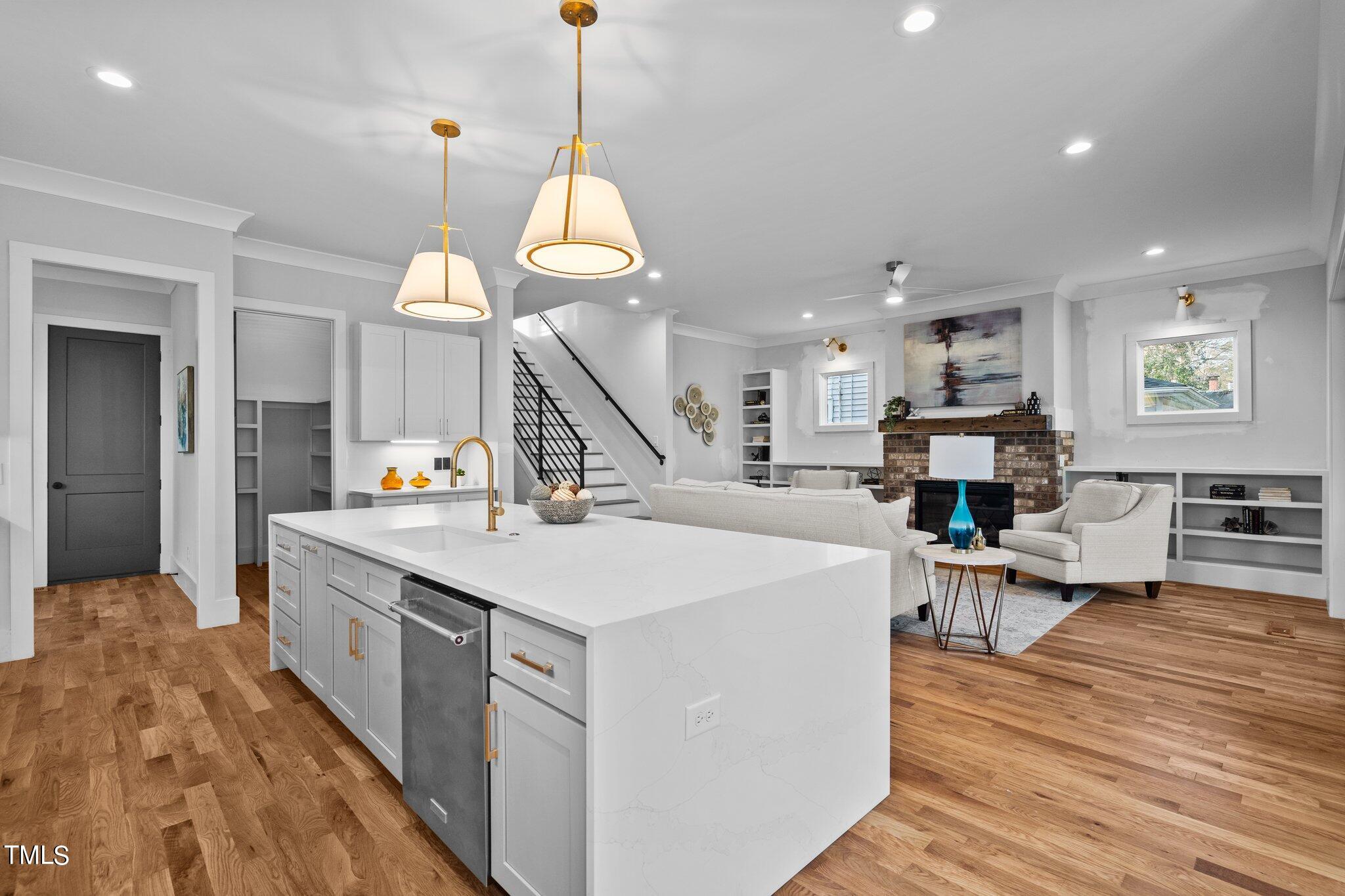 421 Harding Street Raleigh, NC 27604 - Photo 34 of 50 a large kitchen with stainless steel appliances kitchen island a large island in the center