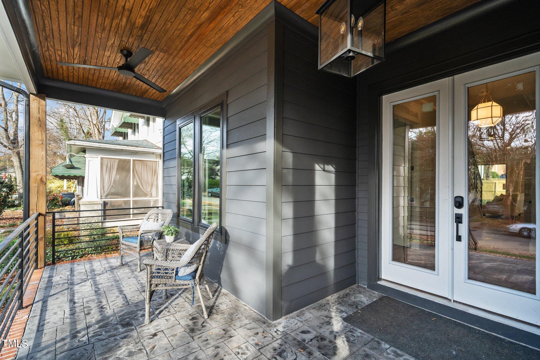 421 Harding Street Raleigh, NC 27604 - Photo 36 of 50 a patio with yard glass top table and chairs
