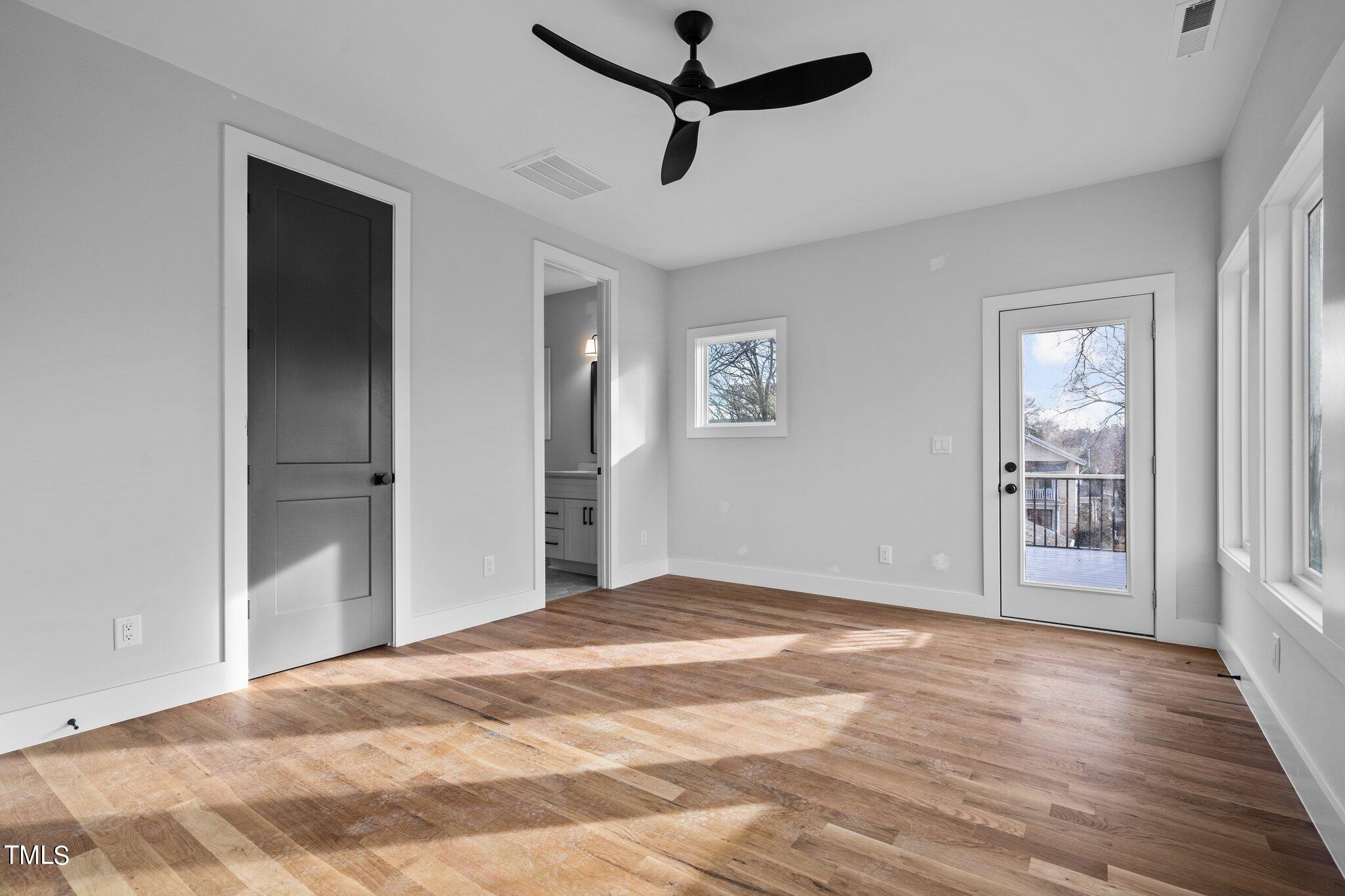421 Harding Street Raleigh, NC 27604 - Photo 6 of 50 a view of a room with wooden floor and windows