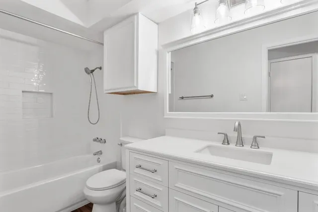 a bathroom with a sink a toilet and a bathtub