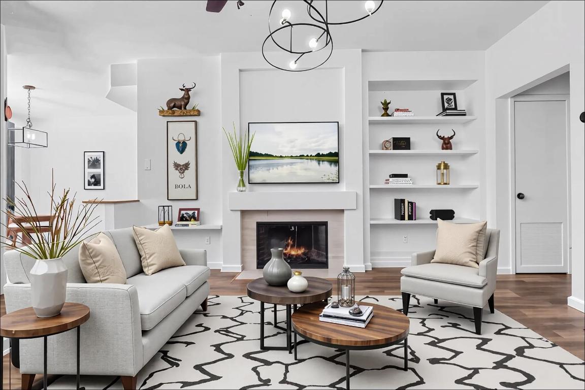 4711 Spicewood Springs Road, Unit 166 Austin, TX 78759 - Photo 5 of 25 a living room with furniture a rug and a fireplace