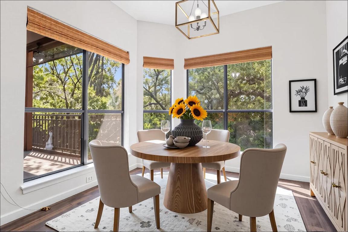 4711 Spicewood Springs Road, Unit 166 Austin, TX 78759 - Photo 7 of 25 a view of a dining room with furniture large windows and wooden floor