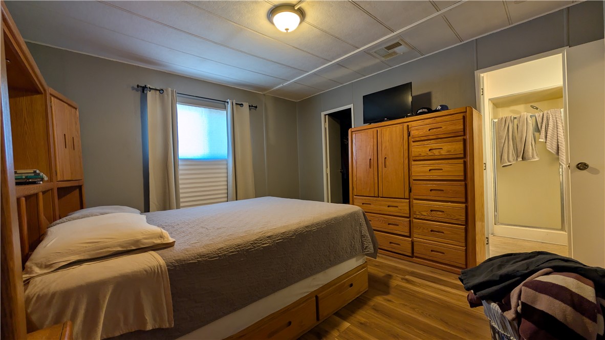 1560 Massachusetts, Unit 96 Riverside, CA 92507 - Photo 11 of 17 a bedroom with a bed and a dresser