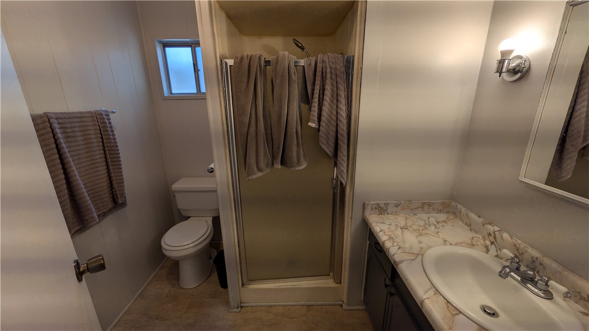 1560 Massachusetts, Unit 96 Riverside, CA 92507 - Photo 13 of 17 a bathroom with a sink toilet and shower