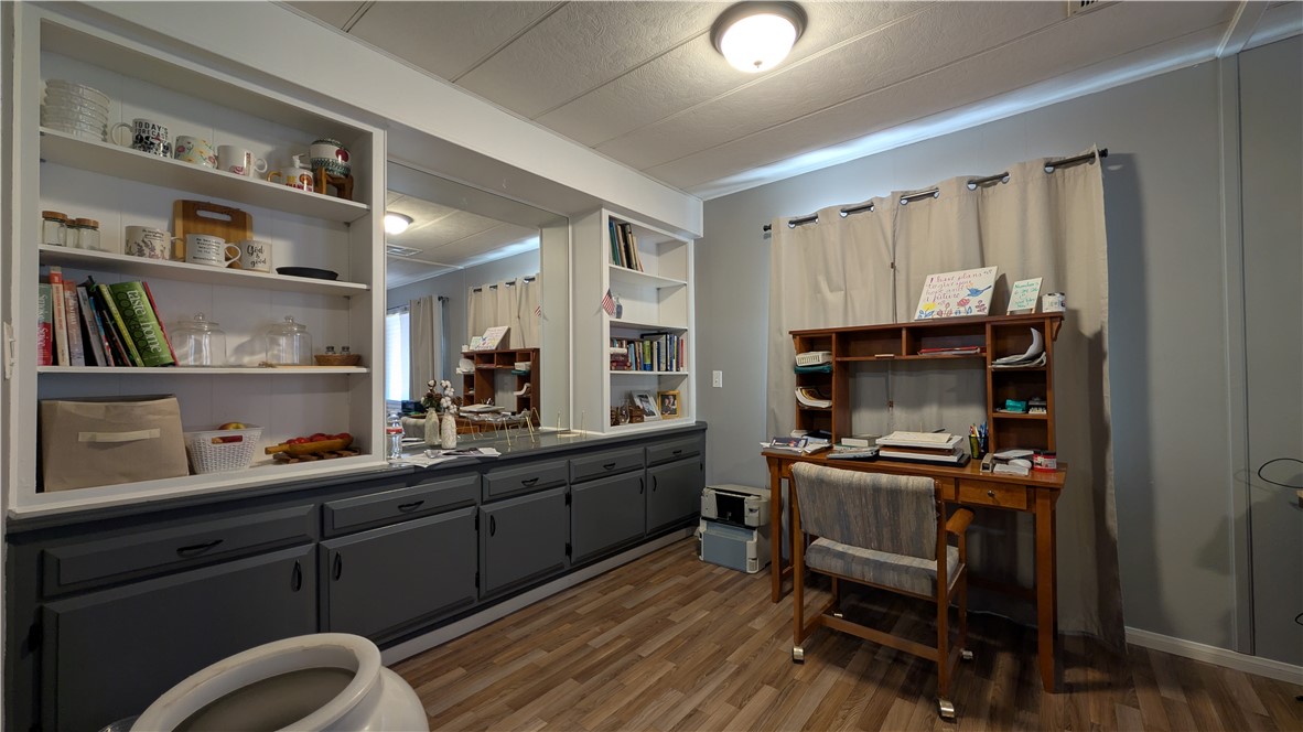 1560 Massachusetts, Unit 96 Riverside, CA 92507 - Photo 15 of 17 a kitchen with a table chairs refrigerator and a sink
