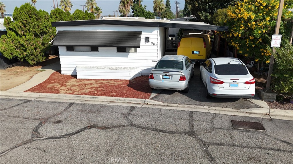 1560 Massachusetts, Unit 96 Riverside, CA 92507 - Photo 2 of 17 a view of a back yard of the house