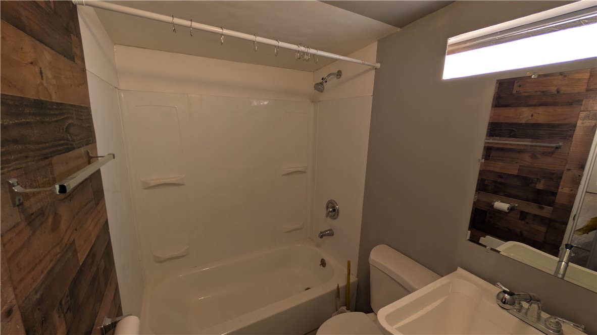 1560 Massachusetts, Unit 96 Riverside, CA 92507 - Photo 6 of 17 a bathroom with a bathtub and a shower