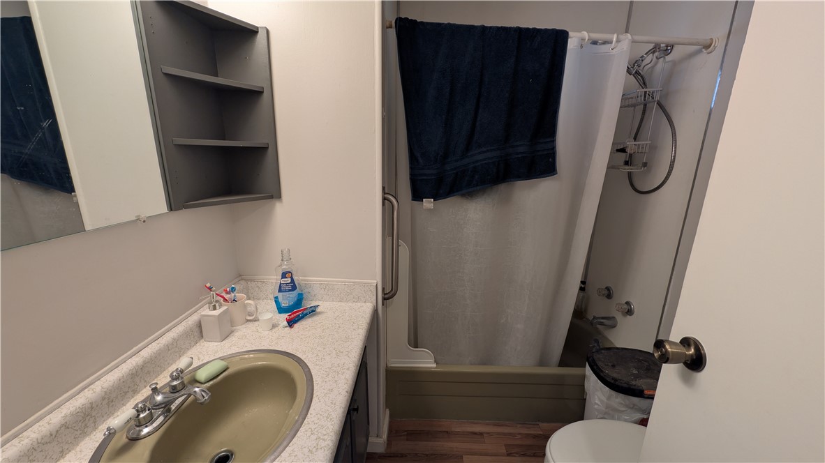 1560 Massachusetts, Unit 96 Riverside, CA 92507 - Photo 9 of 17 a bathroom with a sink toilet and shower