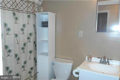 14549 Round Hill Road King George, VA 22485 - Photo 11 of 15 a bathroom with a sink and toilet