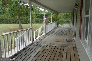 14549 Round Hill Road King George, VA 22485 - Photo 3 of 15 a view of balcony with wooden floor