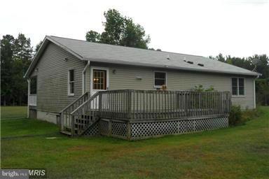 14549 Round Hill Road King George, VA 22485 - Photo 4 of 15 a view of a house with a small yard and deck