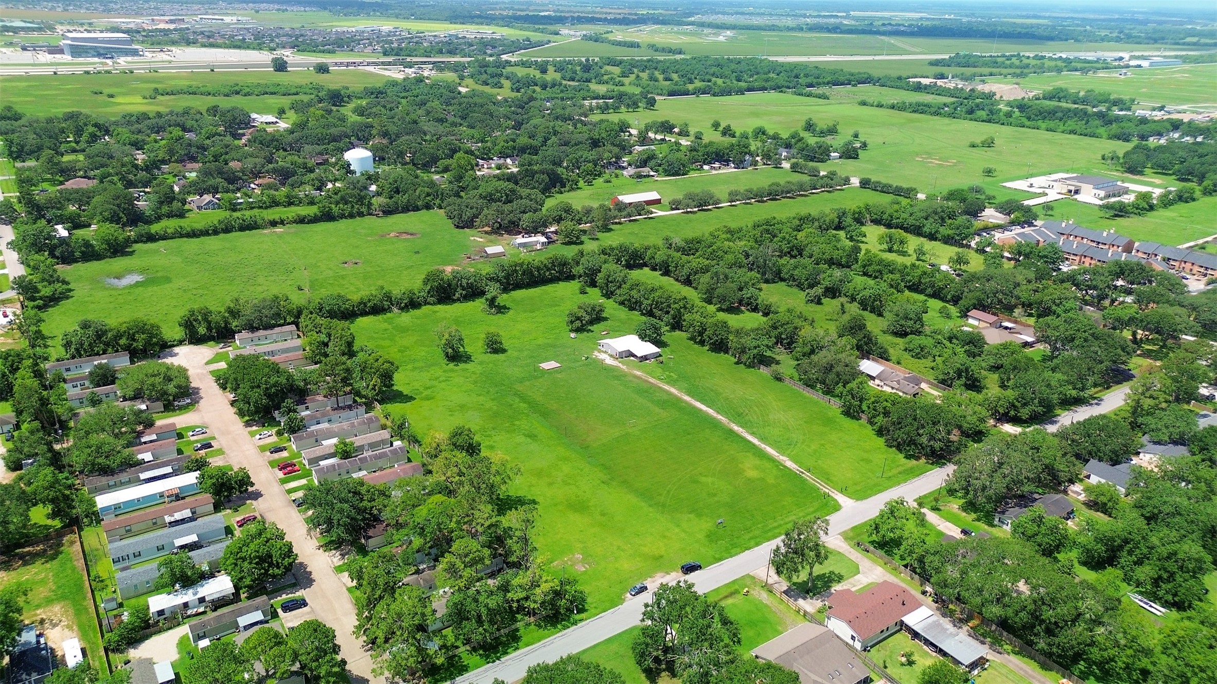 1126 Brooks Avenue Rosenberg, TX 77471 - Photo 13 of 15 a view of a lush green field