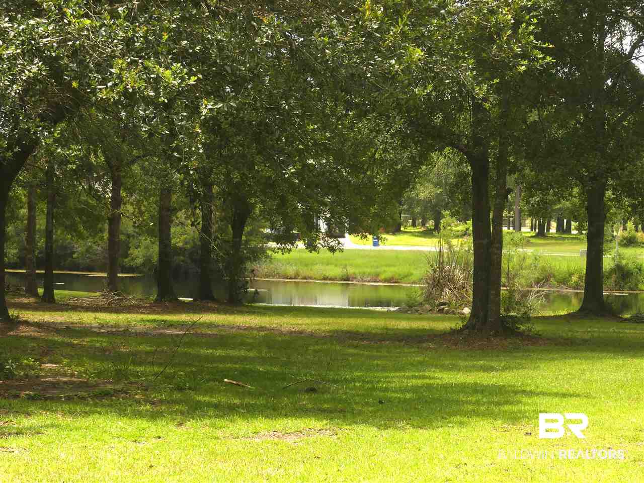 7117 Raintree Lane Gulf Shores, AL 36542 - Photo 21 of 23 Common Area & Pond