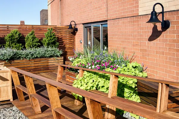a view of a backyard with sitting area