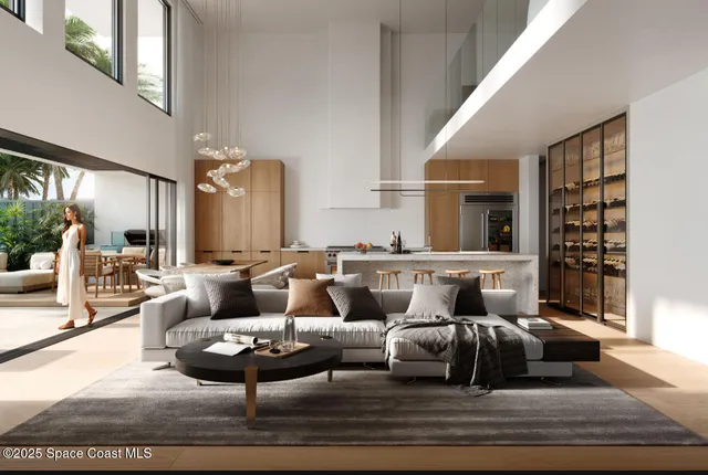 a living room with furniture kitchen view and large window