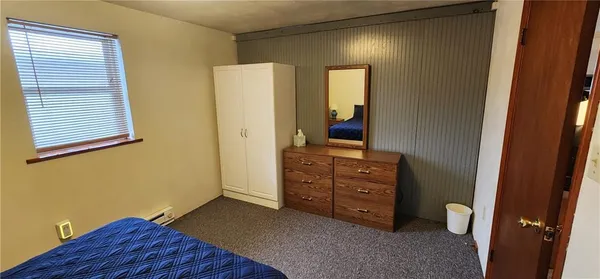 a view of room with window and bathroom