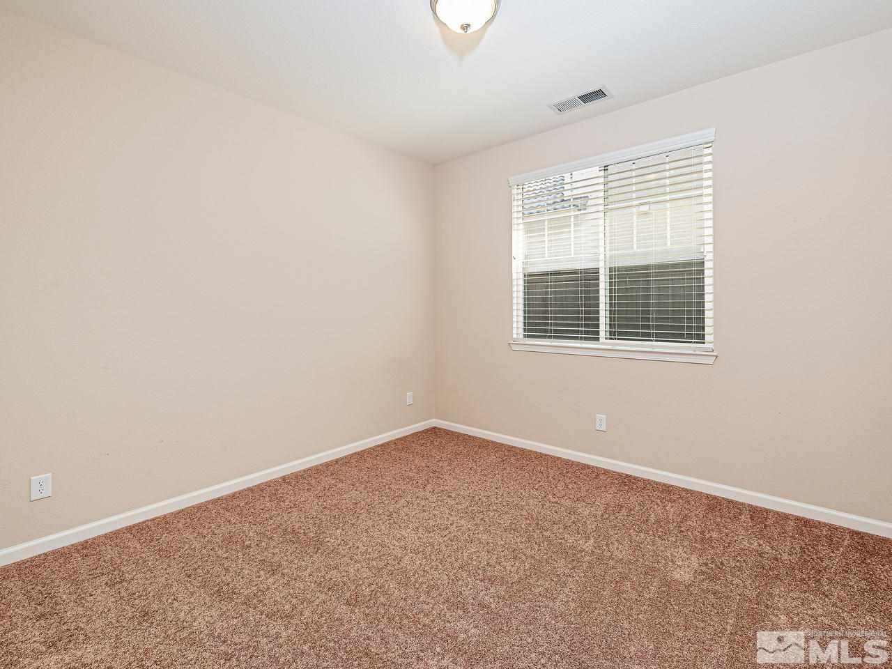 560 Little Sorrel Court Reno, NV 89521 - Photo 14 of 16 an empty room with a window