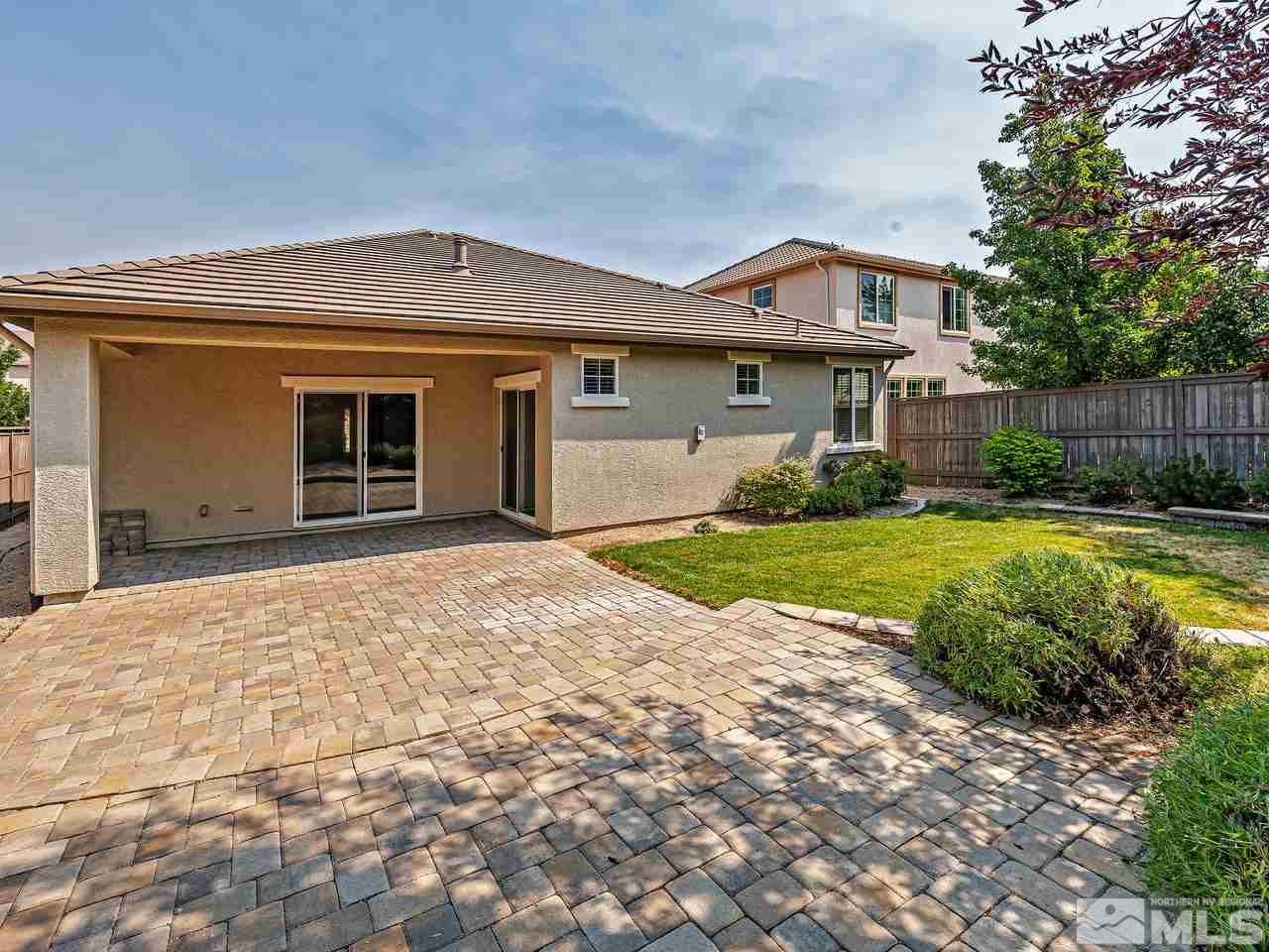 560 Little Sorrel Court Reno, NV 89521 - Photo 16 of 16 a front view of a house with yard and garage