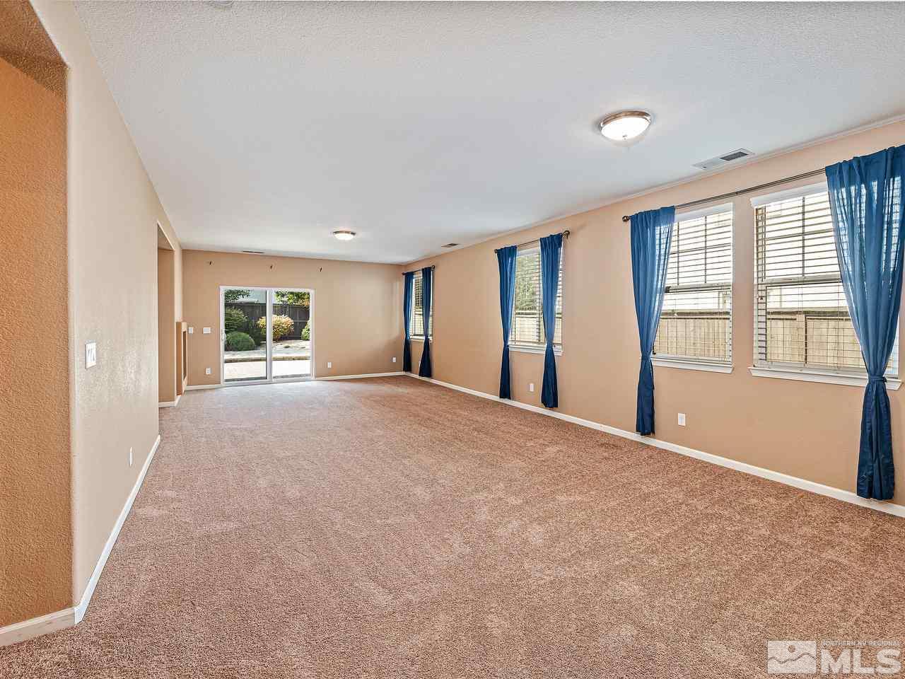 560 Little Sorrel Court Reno, NV 89521 - Photo 7 of 16 a view of an empty room with a window