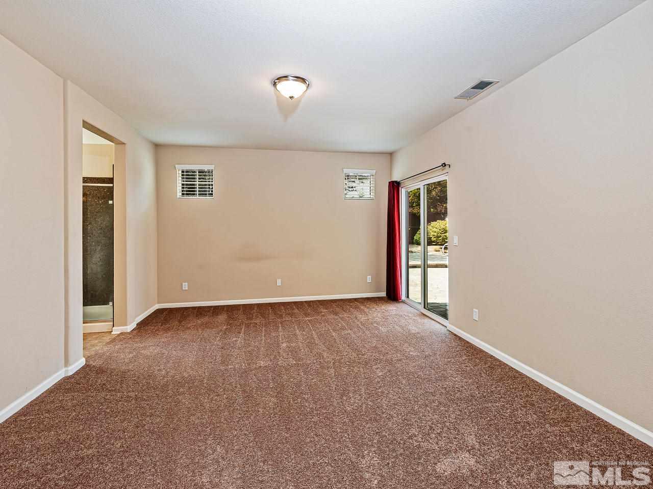 560 Little Sorrel Court Reno, NV 89521 - Photo 9 of 16 an empty room with windows