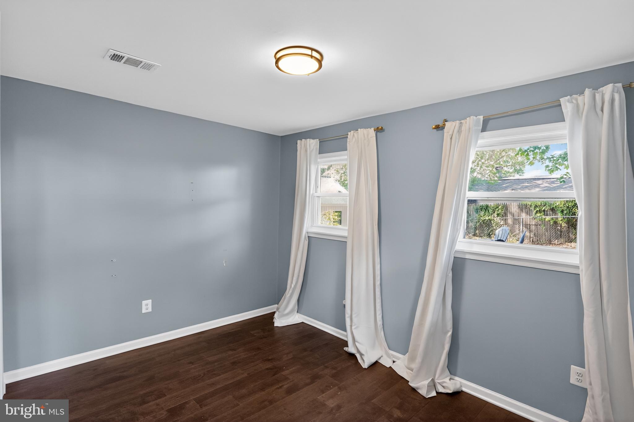 3670 5th Avenue Edgewater, MD 21037 - Photo 26 of 60 an empty room with wooden floor and windows