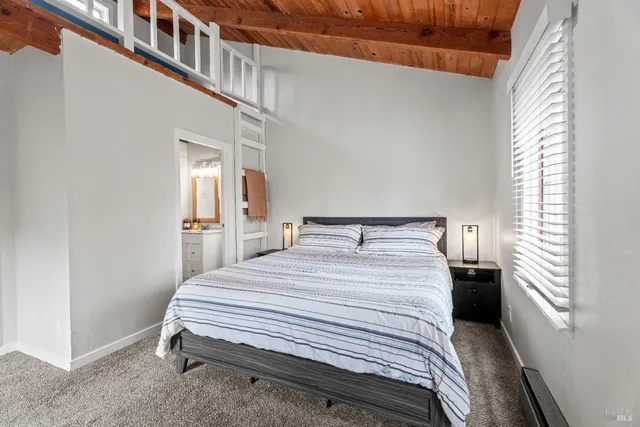 a bedroom with a bed and a cabinets