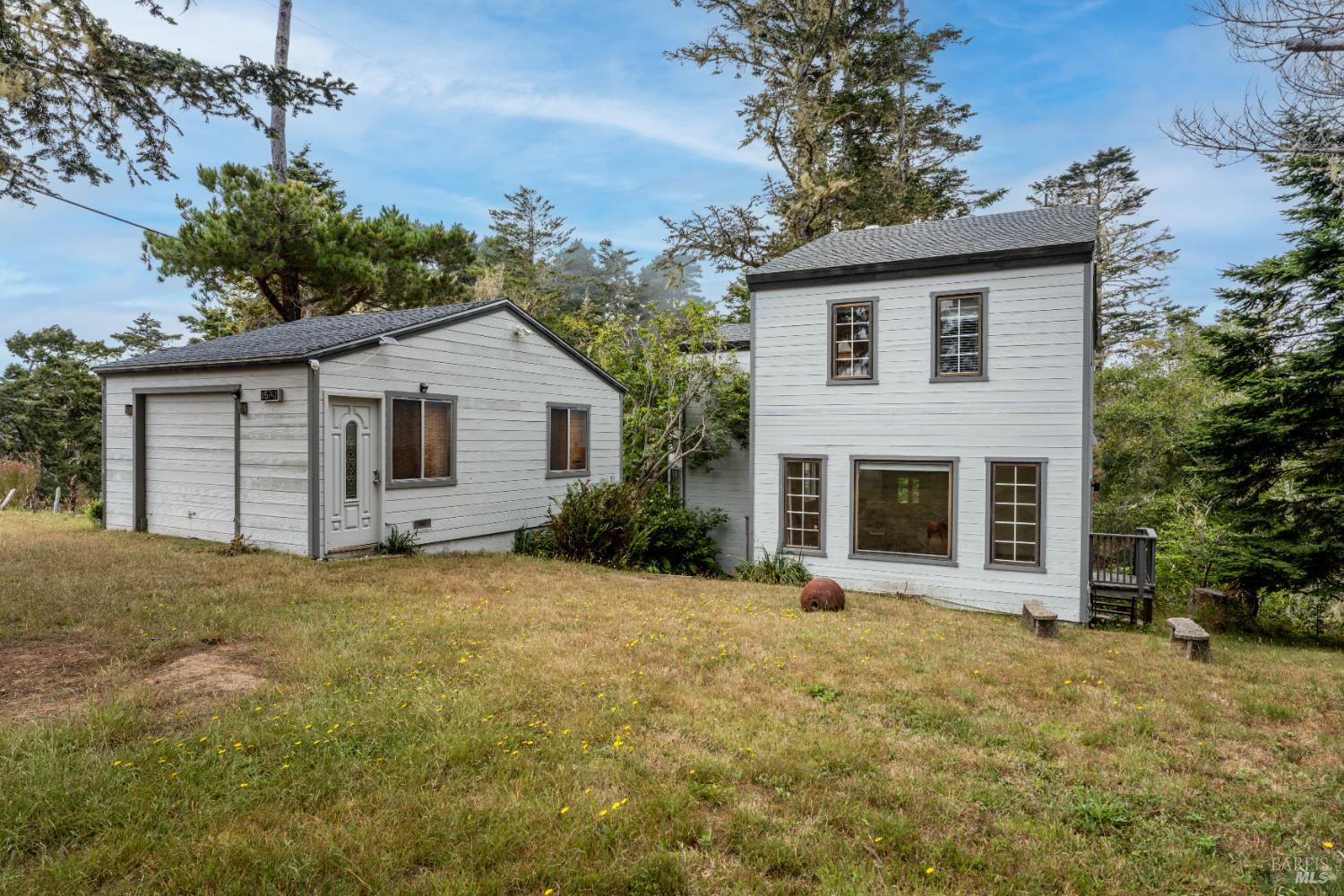 15741 Forest View Road Manchester, CA 95459 - Photo 17 of 28 a front view of a house with yard and trees