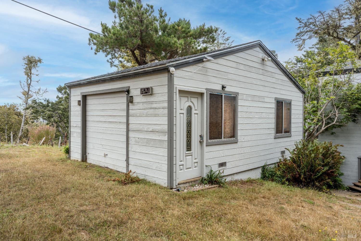 15741 Forest View Road Manchester, CA 95459 - Photo 19 of 28 a view of a house with a yard