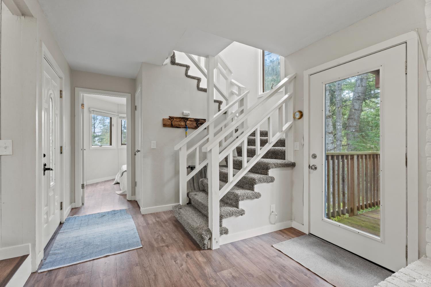 15741 Forest View Road Manchester, CA 95459 - Photo 3 of 28 a view of entryway with wooden floor and a front door