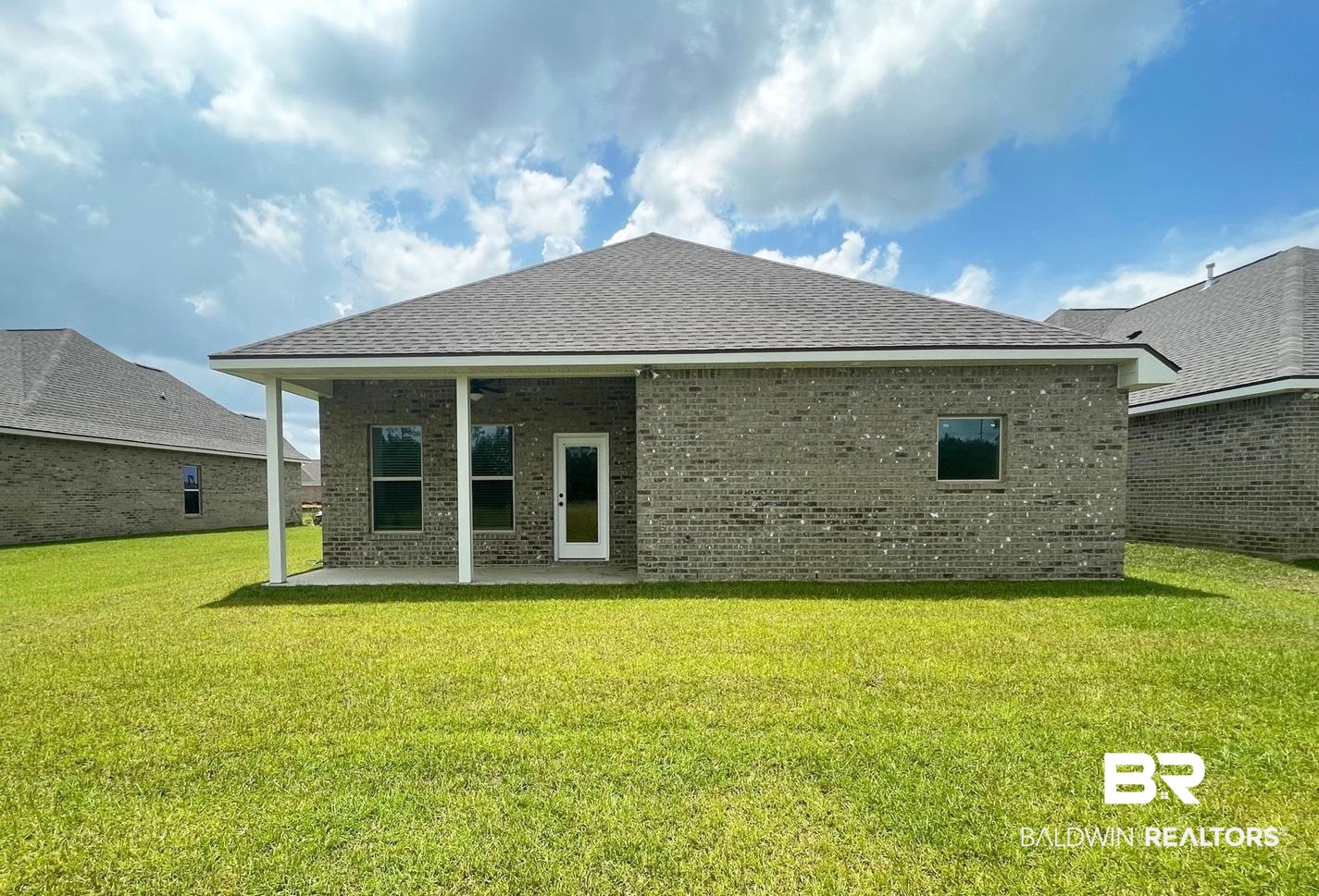 1642 Fenton Circle Foley, AL 36535 - Photo 12 of 14 Rear view of property with a patio and a lawn
