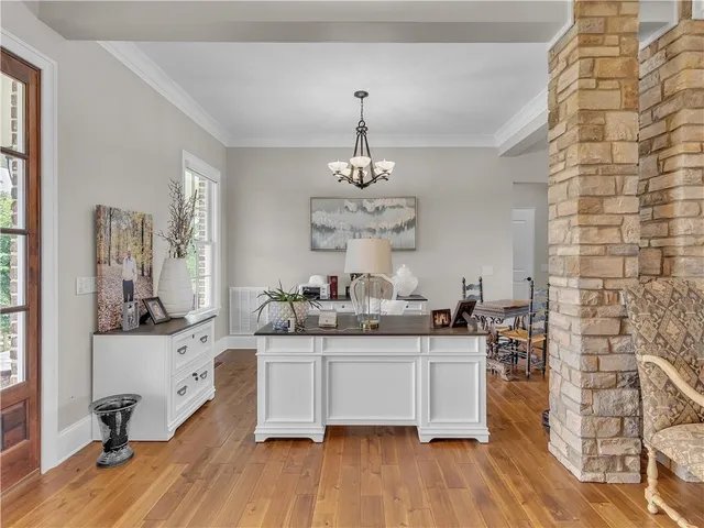 a kitchen with granite countertop a sink stainless steel appliances and cabinets