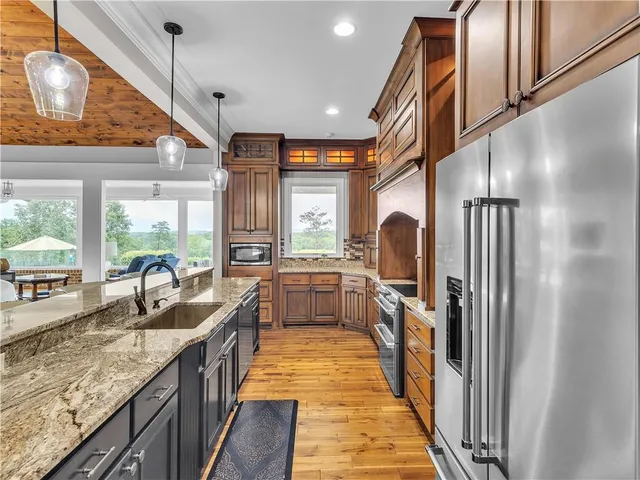 a view of a dining room with furniture wooden floor and a chandelier