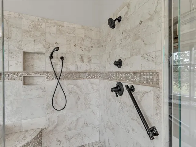a view of a patio with table and chairs with wooden floor and fence