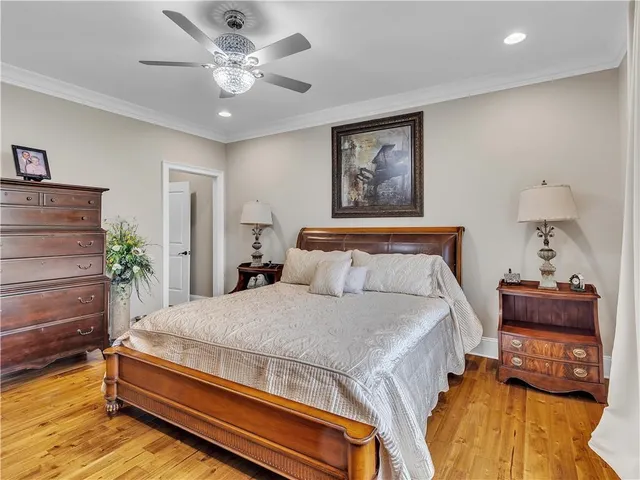 a view of a patio with a table and chairs under an umbrella