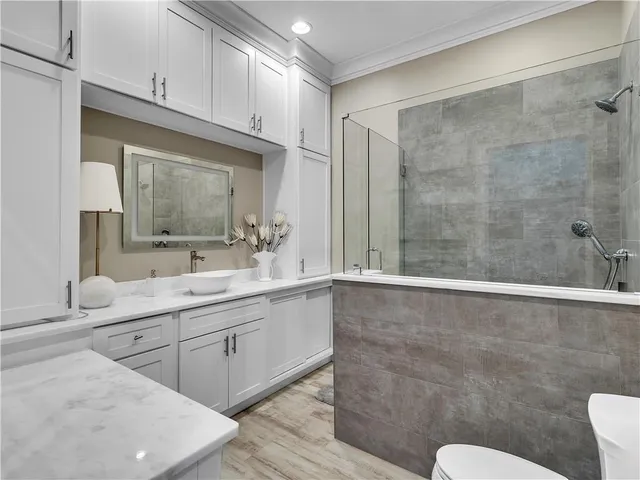 a view of a house with swimming pool and sitting area