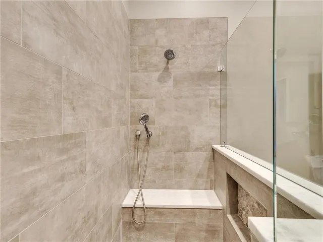 a view of a swimming pool with sitting area