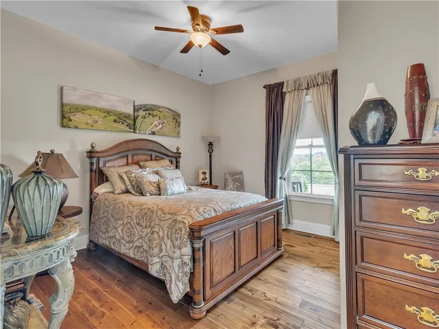 a swimming pool with outdoor seating and a couple of lawn chairs