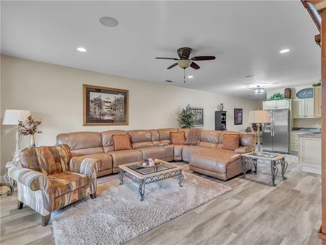a view of a swimming pool with an outdoor seating and a yard