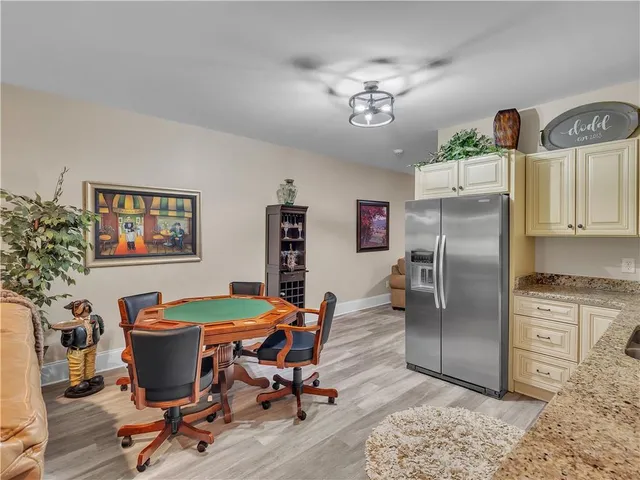 a view of a swimming pool with a table and chairs