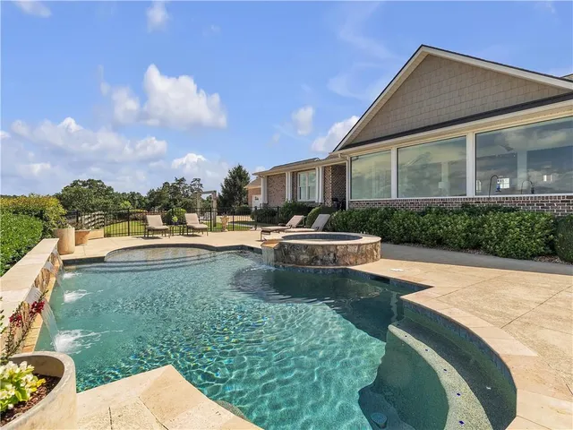 a living room with fireplace furniture and a flat screen tv