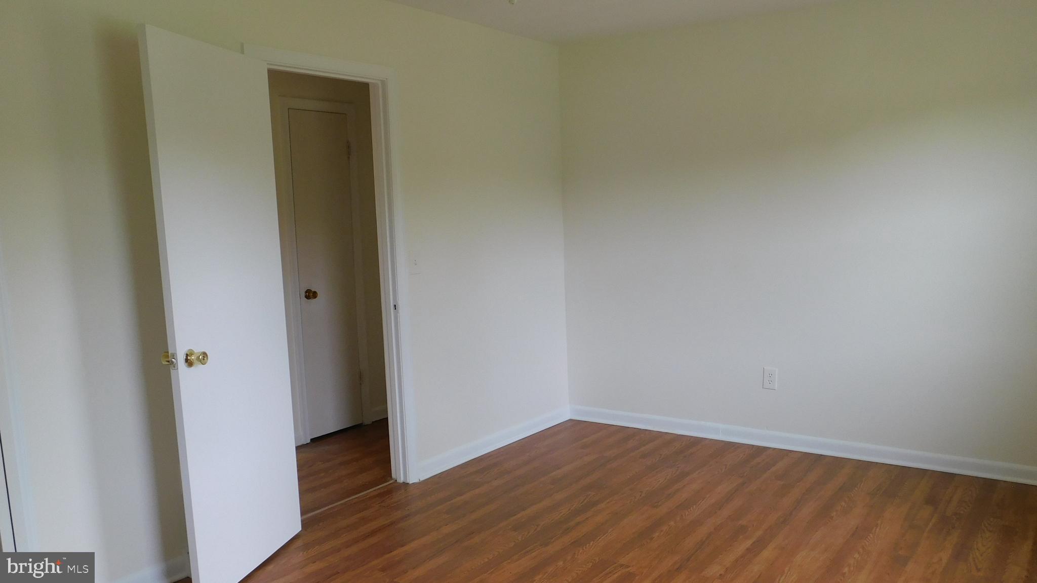 205 Guard Road Middletown, VA 22645 - Photo 16 of 26 wooden floor in an empty room