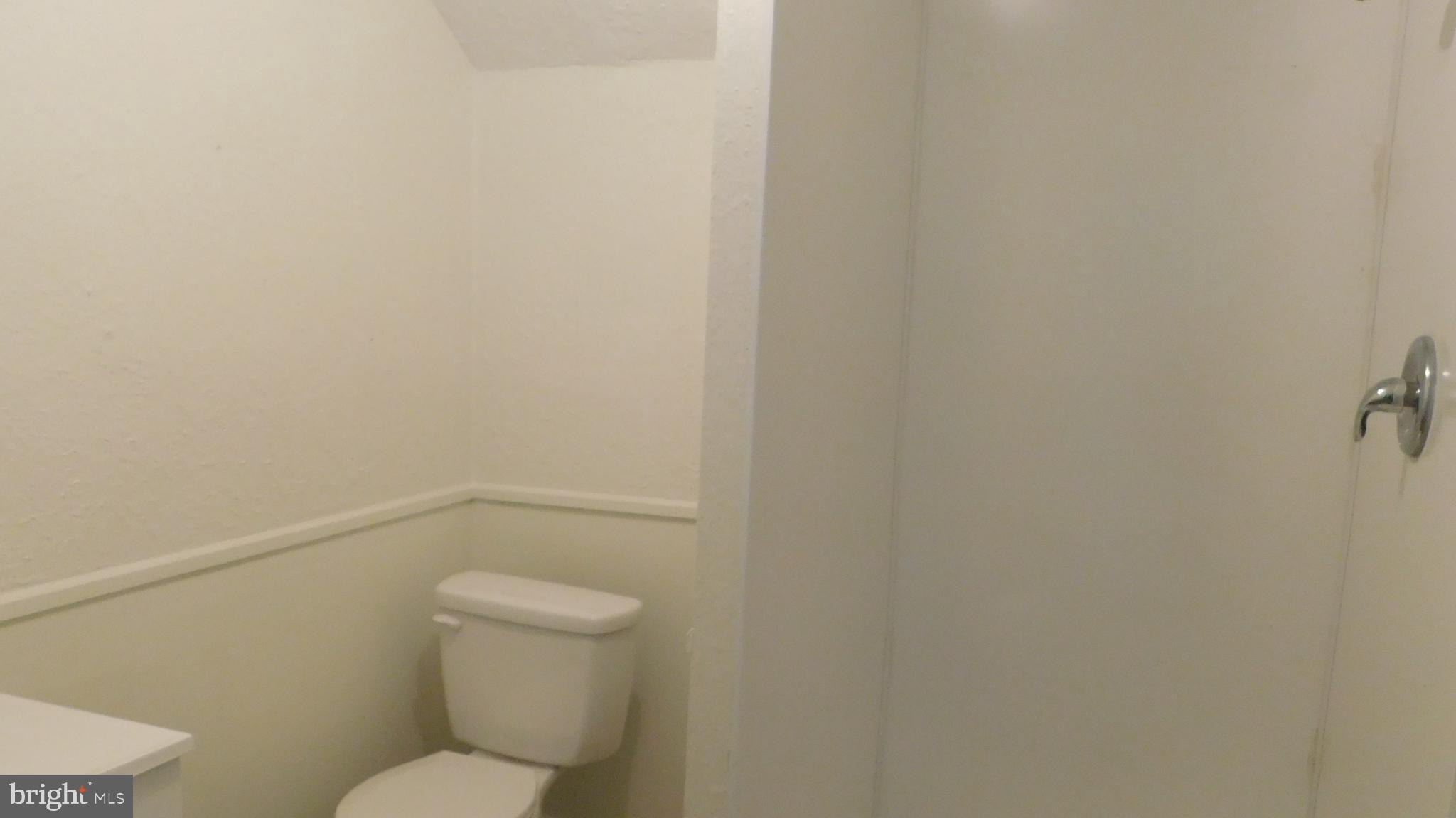 205 Guard Road Middletown, VA 22645 - Photo 18 of 26 a white toilet sitting next to a shower