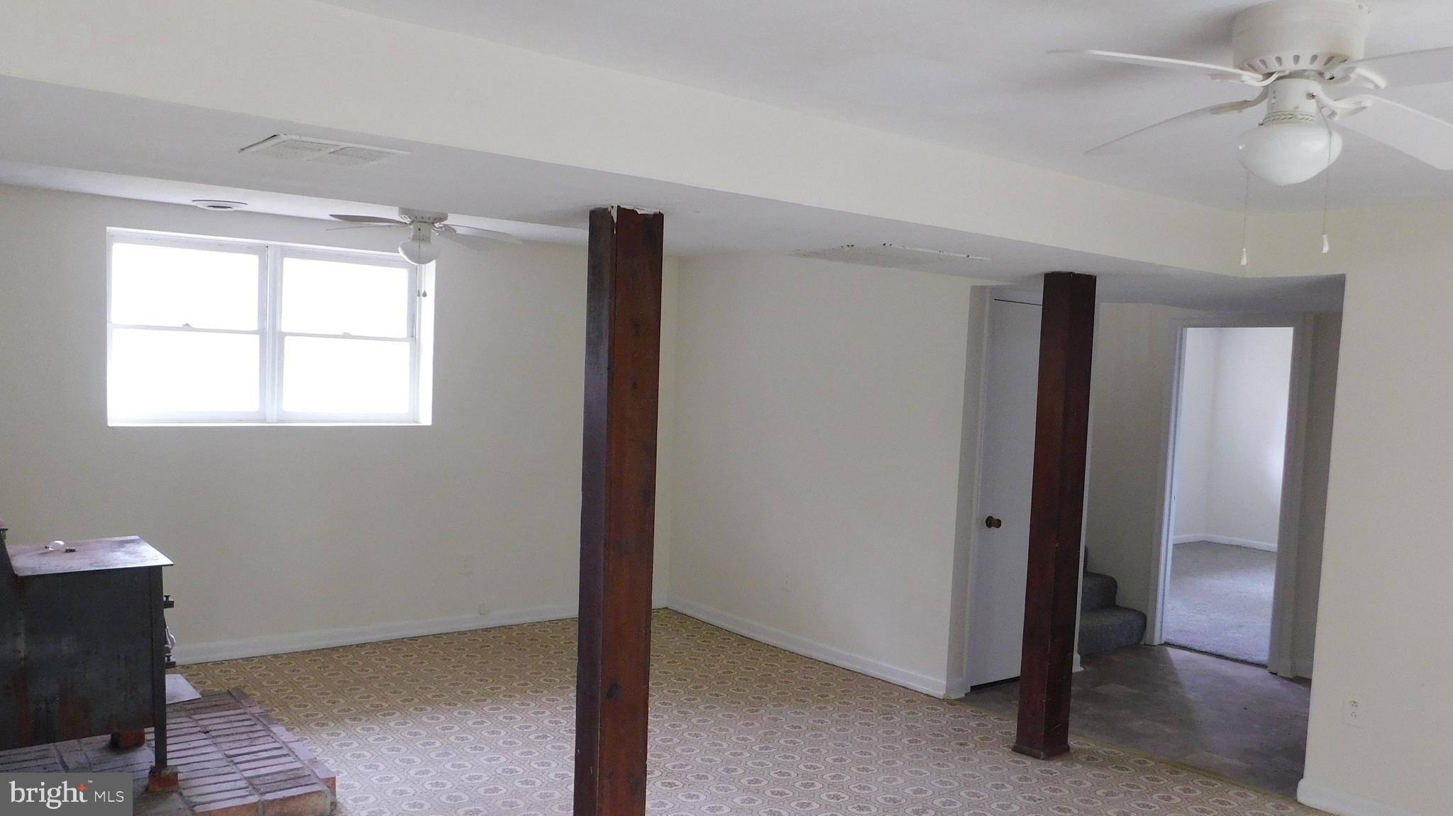 205 Guard Road Middletown, VA 22645 - Photo 20 of 26 a view of an empty room with a window
