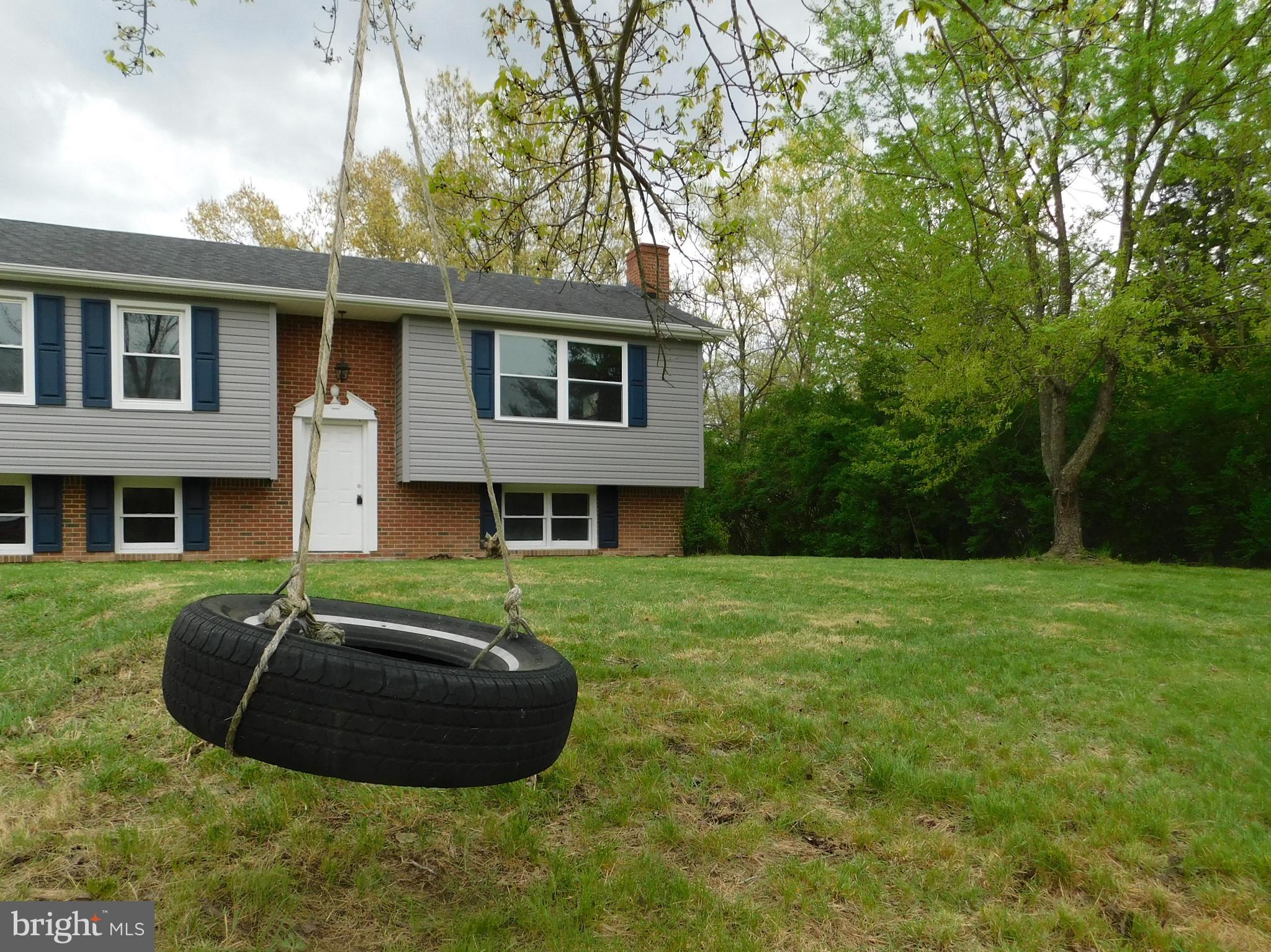 205 Guard Road Middletown, VA 22645 - Photo 3 of 26 a view of a house with a backyard