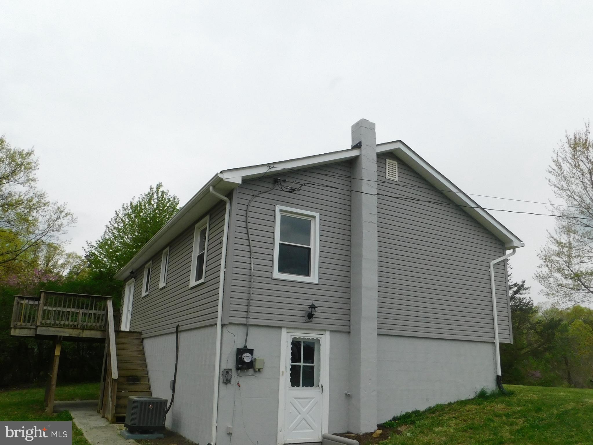 205 Guard Road Middletown, VA 22645 - Photo 26 of 26 a front view of a house with a yard