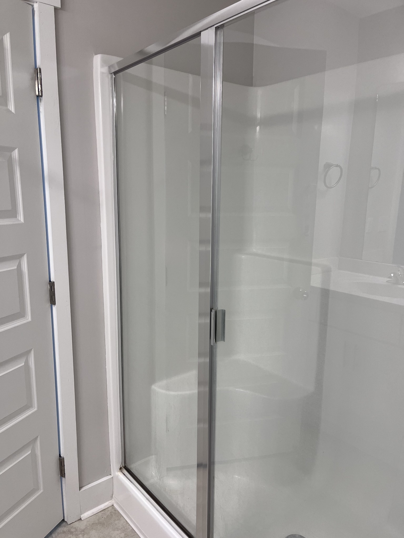 8011 Tuberose Court Spring Hill, TN 37174 - Photo 15 of 20 a bathroom with a glass shower door
