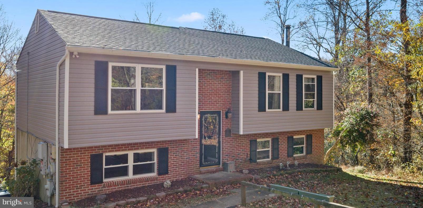 7410 Dakota Avenue Chesapeake Beach, MD 20732 - Photo 11 of 68 a front view of a house with garden